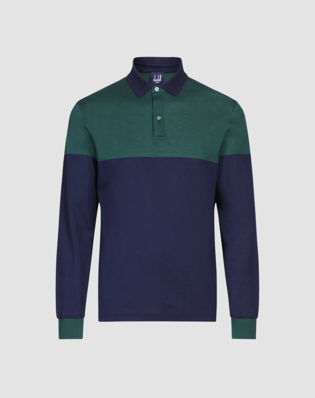 Polo is shown in violet with lilac colour block detailing to upper chest and cuffs