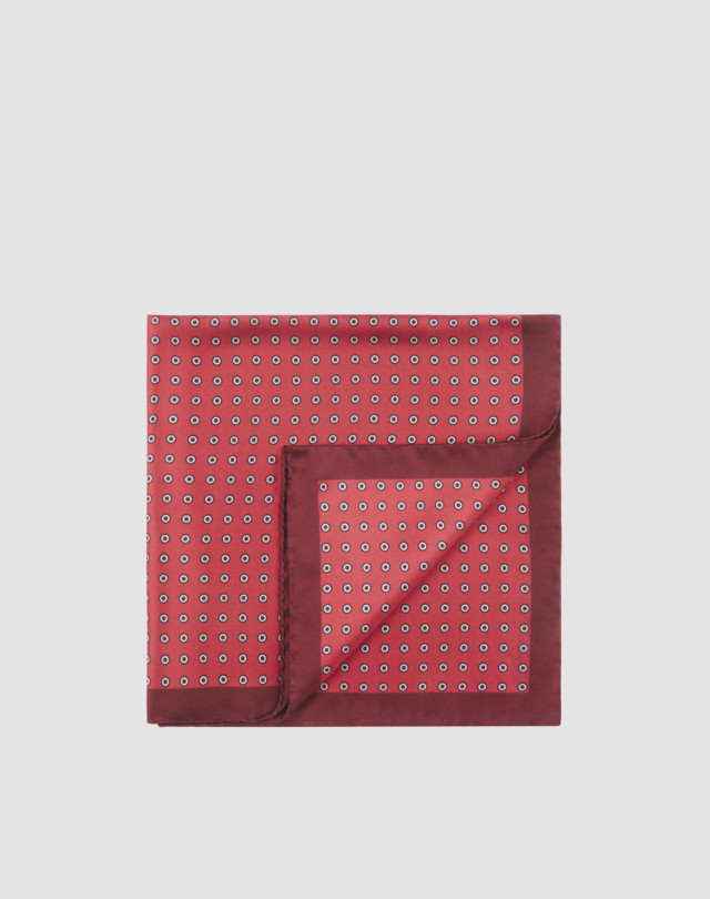 Pocket square is shown in red with burgundy border and black and white circles print