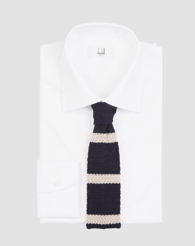 Tie is shown in navy with cream horizontal stripes