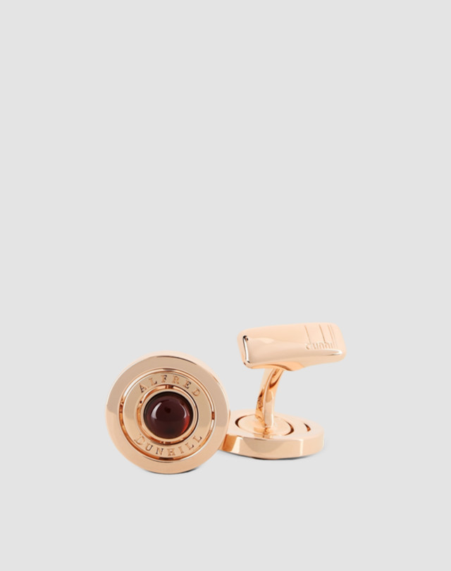 Cufflinks are shown in rose-gold finish with garnet insert