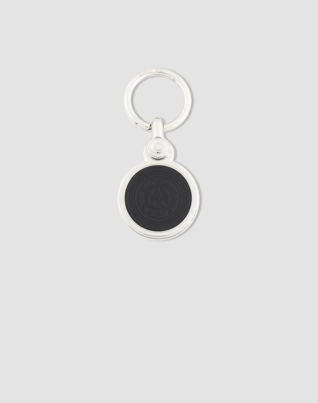 Key fob is shown in silver finish with navy and tan leather faces